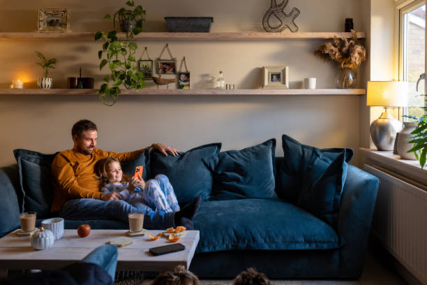 A parent and child sharing a quiet moment on the sofa